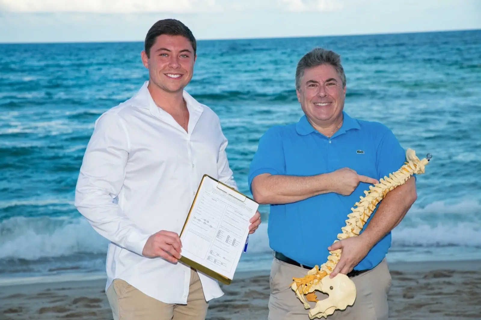 About Dr. Jason Dulberg and Dr. Mark Dulberg of Luxury Chiropractic standing on the beach in North Miami Beach, Florida